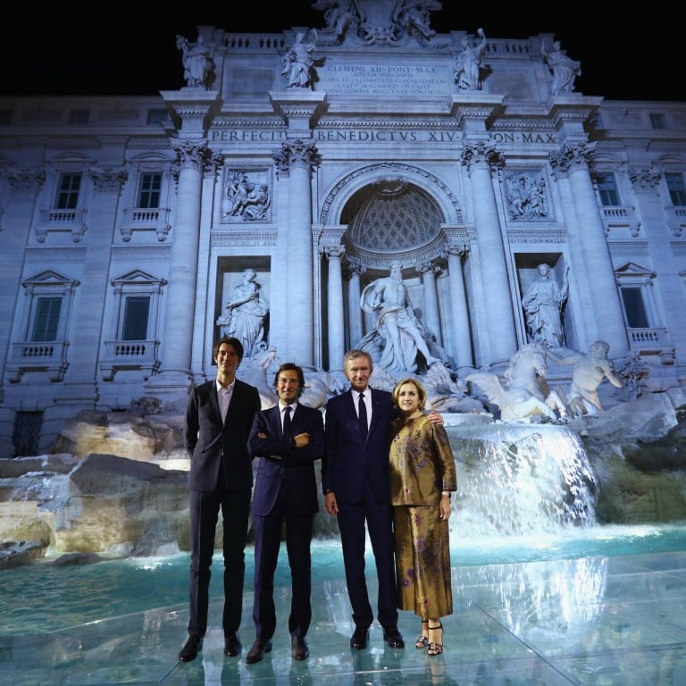 Alexandre Arnault, Pietro Beccari, Bernard Arnault and Silvia Venturini Fendi attend the Fendi 90th anniversary fashion show at Trevi Fountain #stylescmp
