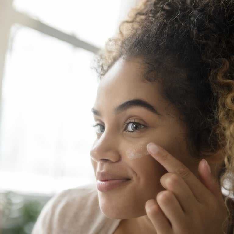 Applying lotion. Photo: Jamie Grill/Getty Images