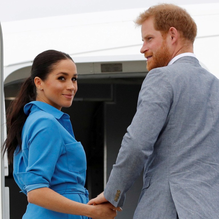 Britain’s Prince Harry and Meghan, Duchess of Sussex look on before departing from Fua’amotu International Airport in Tonga October 26, 2018. Photo: Reuters