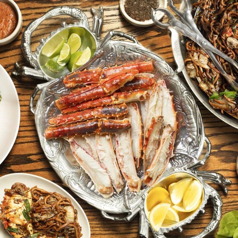 Salted duck egg yolk fried king crab with curry leaves, kombu butter grilled king crab legs and king crab Hokkien mee at Ssäm bar. Photo: Andrew Bezek