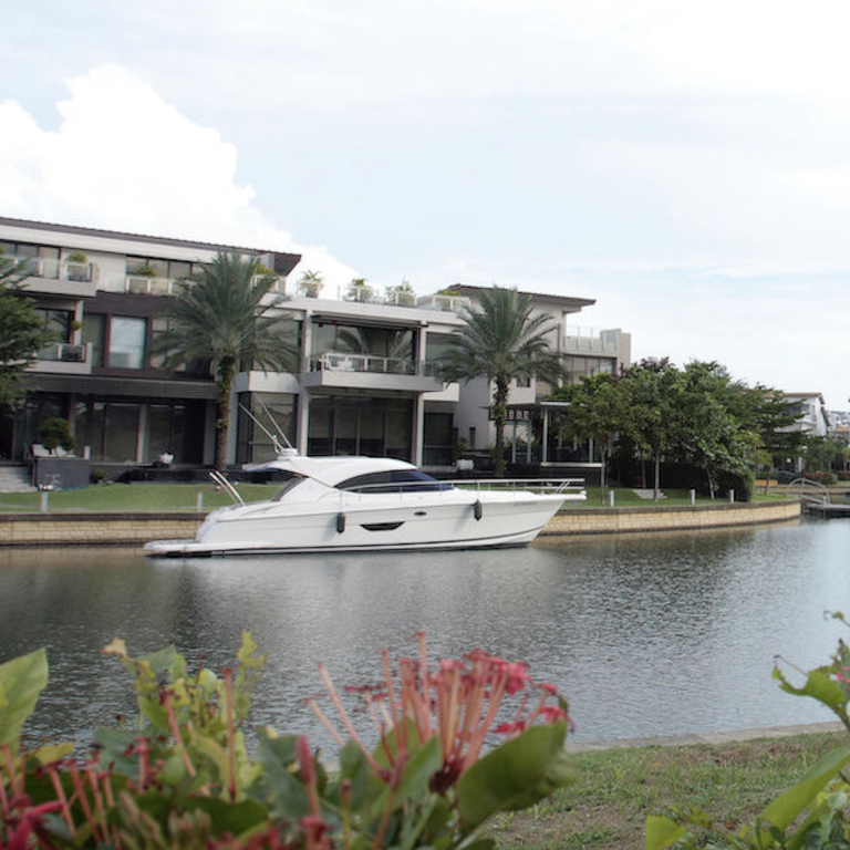 Bungalows with private berths along the waterway are typical of the sorts of property available in Sentosa Cove, Singapore, often at lower prices than comparable property on the mainland. Photo: EdgeProp Singapore