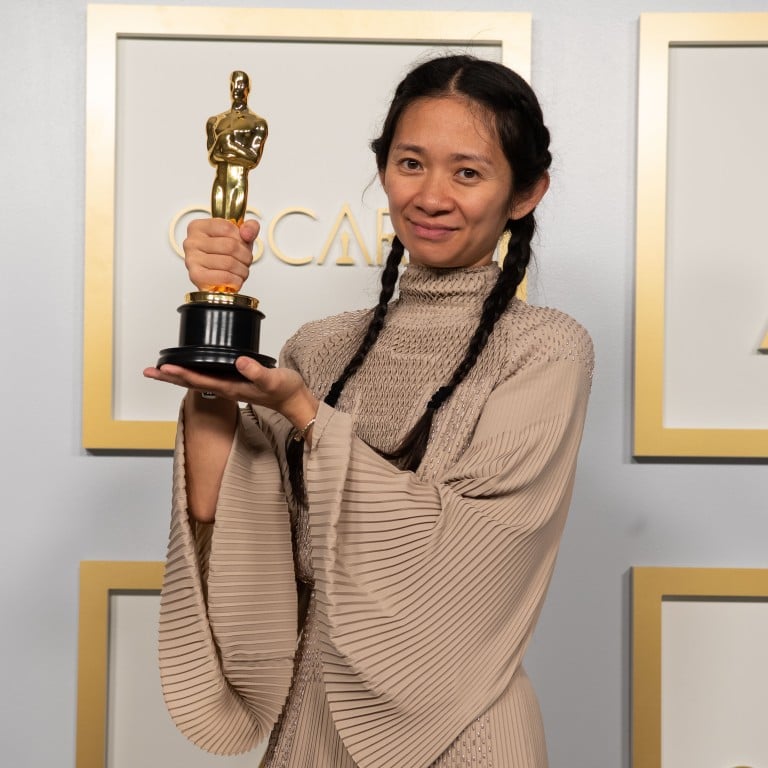 Chinese director and producer Chloe Zhao poses with one of her Oscars awards for best picture and director for Nomadland, at the press room of the 93rd Oscars Academy Awards at Union Station in Los Angeles on April 25, 2021. Photo: AMPAS/PA Media/DPA