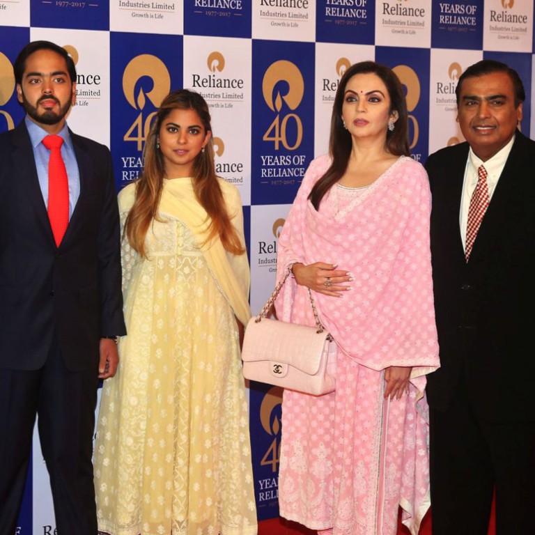 The Ambanis, from left to right: Akash, Anant, Isha, Nita, and Mukesh. Reuters