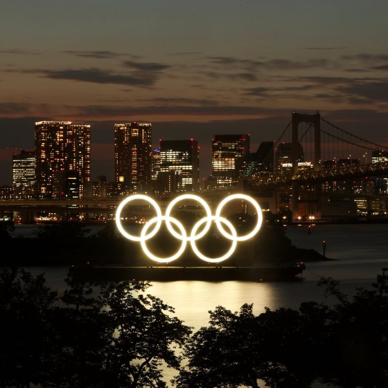 A general view of the Olympic Rings installed on a floating platform with the Rainbow Bridge in the background in preparation for the Tokyo 2020 Olympic Games in Tokyo, Japan, on June 21, 2021. Photo: Reuters