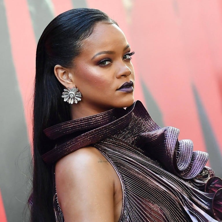 Rihanna shines bright like a diamond, or should that be several diamonds? The multi-hyphenate star is now officially a billionaire. Photo: AFP