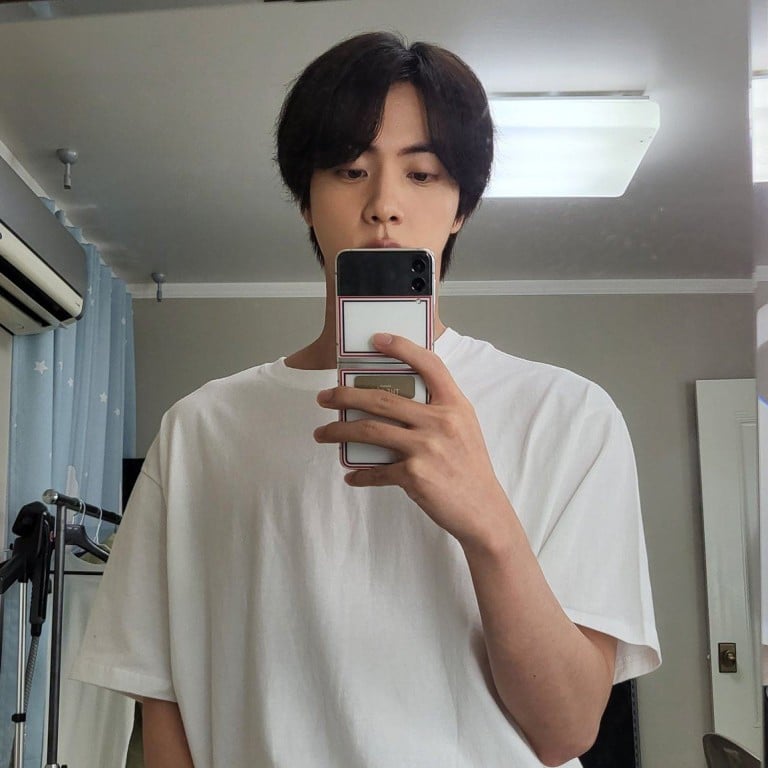 BTS Jin with his Galaxy Z Flip 3 Thom Browne Edition. Photo: @BTS_twt/ Twitter