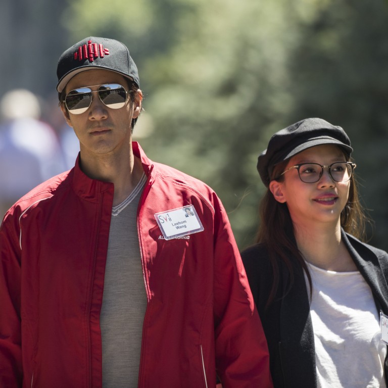 Wang Leehom walks with his wife Li Jinglei in happier times – the couple recently announced their divorce amid a public social media spat and accusations of Wang’s infidelity. Photo: Getty Images