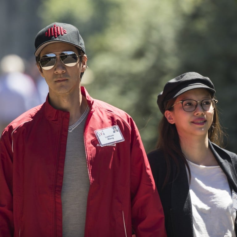 Wang Leehom walks with his wife Li Jinglei in happier times – the couple recently announced their divorce amid a public social media spat and accusations of Wang’s infidelity. Photo: Getty Images