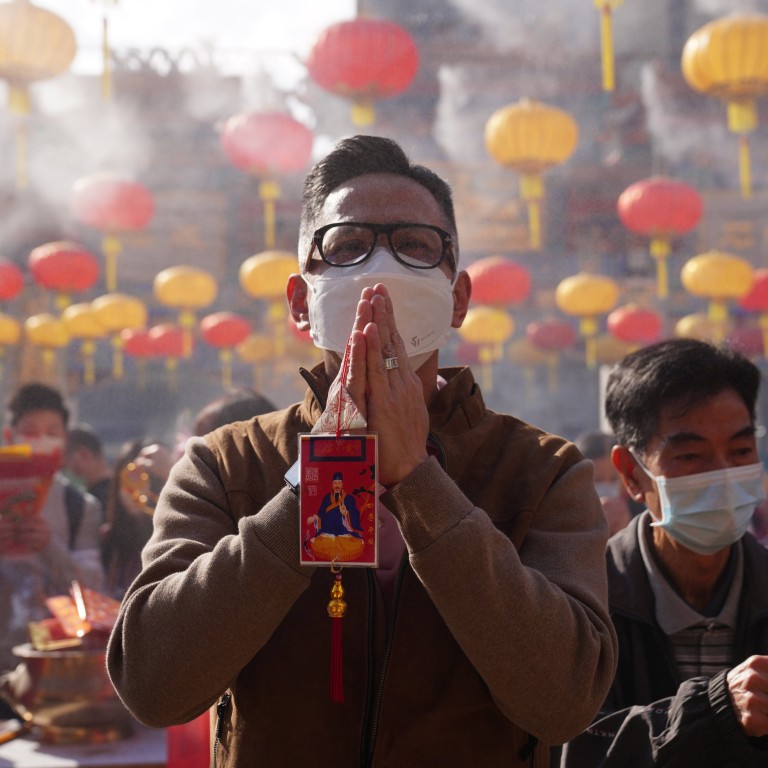 To attract good luck and minimise bad luck, worshippers make offerings on the first day of the Lunar New Year at Hong Kong’s Wong Tai Sin Temple. Photo: Sam Tsang