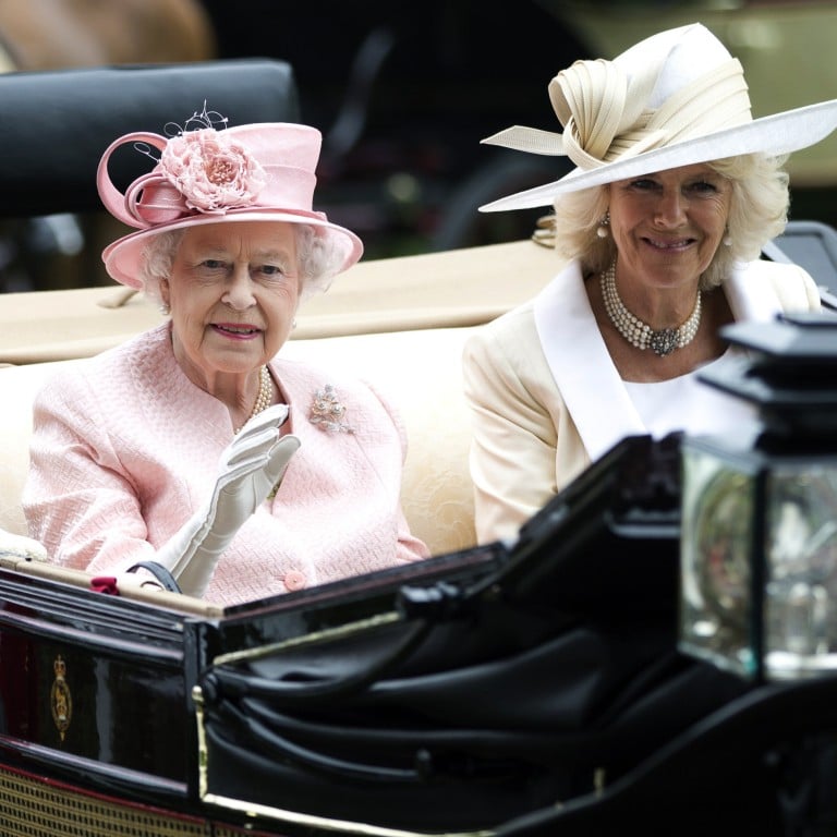 Britain’s Queen Elizabeth waves to the crowds with Camilla, Duchess of Cornwall, as they arrive at Royal Ascot in 2013. Photo: AP