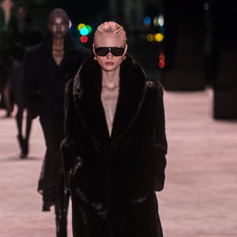 Models present creations from the autumn/winter 2022-23 women’s collection by Saint Laurent during Paris Fashion Week, on March 1, with the runway laid out at the foot of the Eiffel Tower. Photo: EPA-EFE