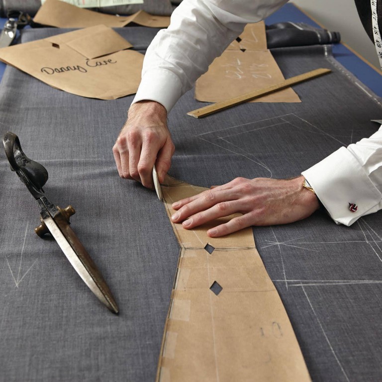 A cutter at work at Stowers London on Savile Row – but are bespoke suits really worth the expense? Photo: Handout