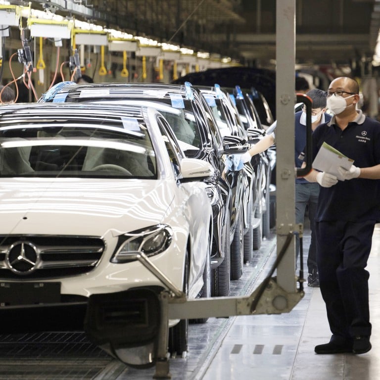 Workers inspect newly assembled cars at a Beijing Benz Automotive Co. Ltd factory, a German joint venture company for Mercedes-Benz, in Beijing, in May 2020. Photo: AP Photo