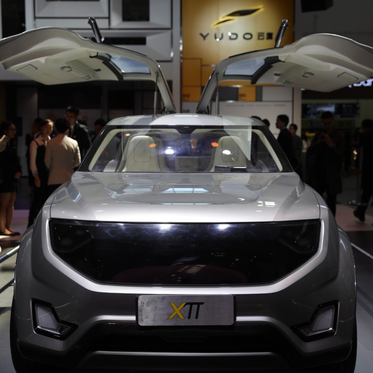 Tesla, NIO, Xpeng face a new rival as Peugeot's Chinese partner Dongfeng  launches all-electric brand Voyah to claim its turf in China's intensifying  EV war
