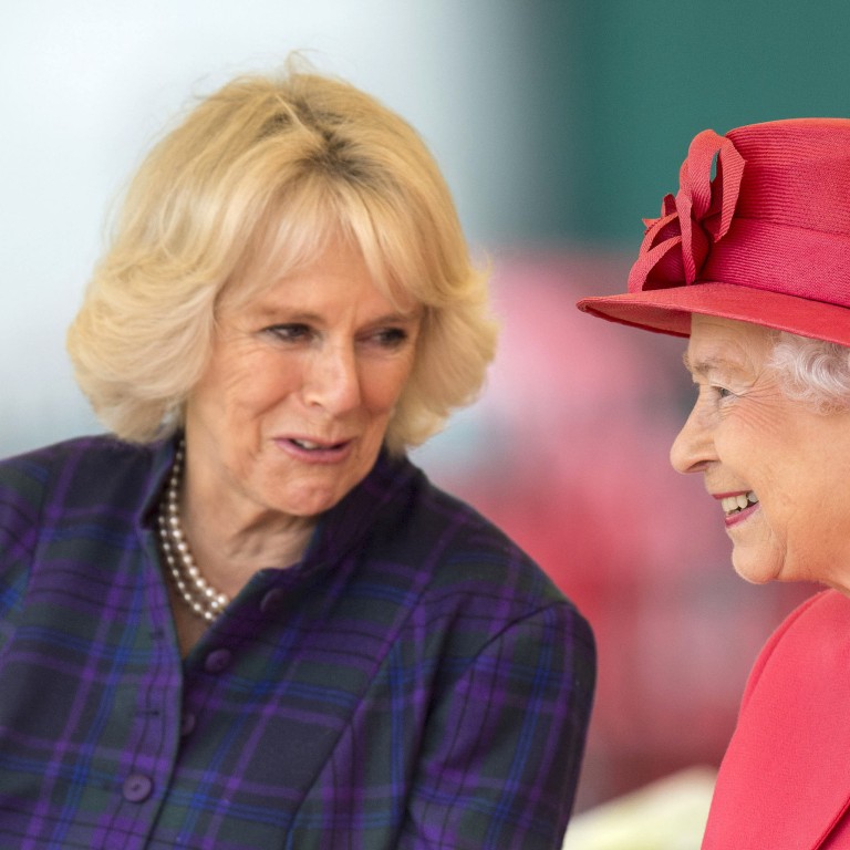 Queen Elizabeth and Camilla, Duchess of Cornwall at Ebony Horse Club Community Riding Centre in October 2013, in London, England. Photo: Getty Images