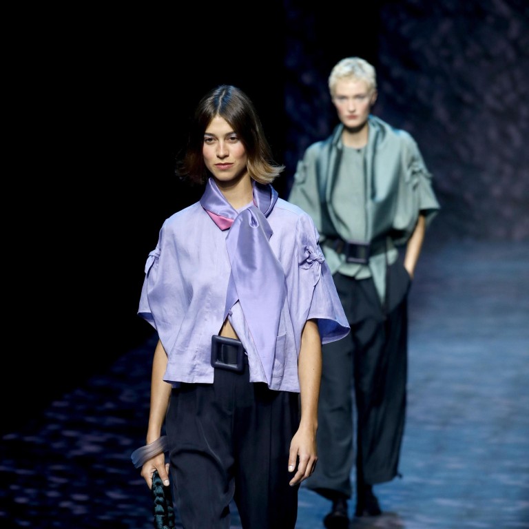 Models present creations by Italian designer Giorgio Armani for his label Emporio Armani from the spring/summer 2023 collection during the Milan Fashion Week, in Milan, Italy, on September 22. Photo: EPA-EFE