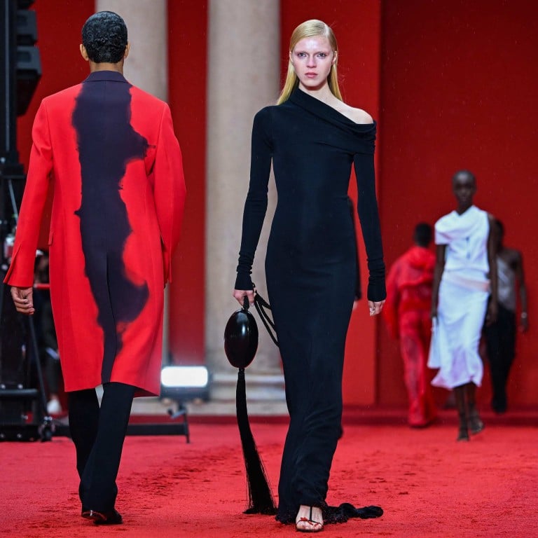 Models walk across red sand for Salvatore Ferragamo’s women’s and men’s spring/summer 2023 fashion collection on September 24, as part of the Fashion Week in Milan. Photo: AFP