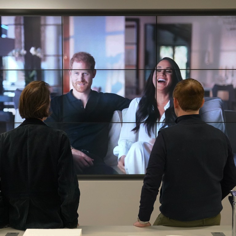 Office workers in London watch Prince Harry and Meghan Markle, the Duke and Duchess of Sussex’s controversial documentary being aired on Netflix, on December 8. Photo: AP