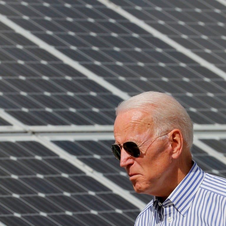 President Joe Biden walks past solar panels while touring the Plymouth Area Renewable Energy Initiative in June 2019. Photo: Reuters