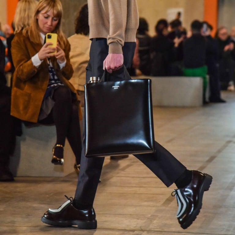 A model presents a creation from the autumn/winter 2023 men’s collection by Prada at the warehouse of the Prada Foundation during the Milan Fashion Week, in Milan, Italy, on January 15. Photo: EPA-EFE