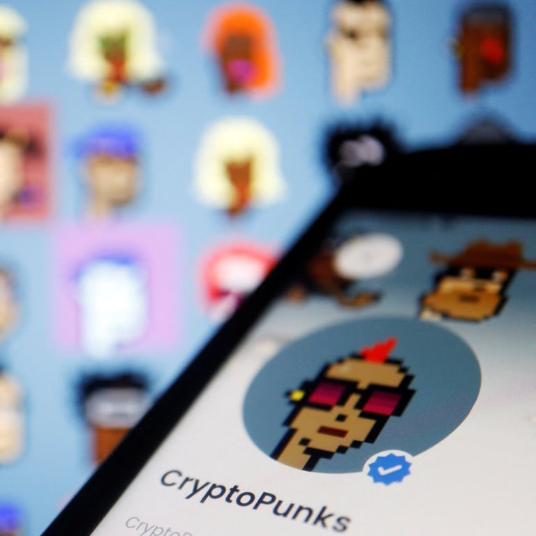 The CryptoPunks page on OpenSea app is displayed next to non-fungible tokens (NFTs) of the CryptoPunks collection by Larva Labs shown on its website, in March 2022. Photo: Reuters