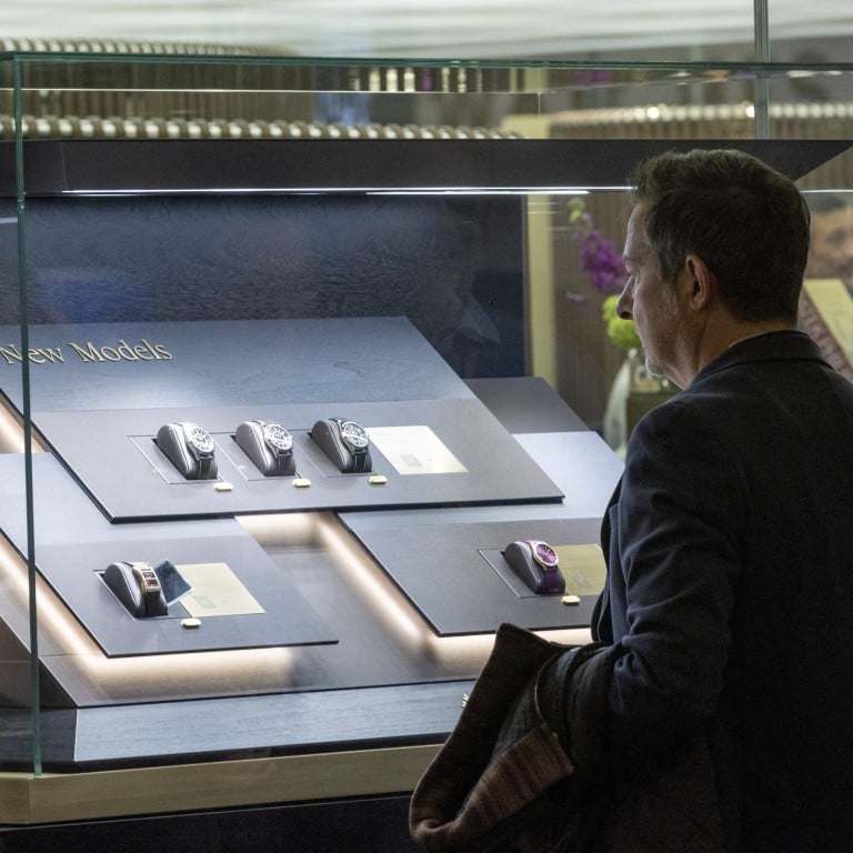 Visitors look at models on the Patek Philippe booth during the Watches and Wonders fair in Geneva, Switzerland, on March 27. Photo: Reuters