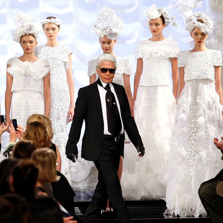 German designer Karl Lagerfeld appears at the end of his spring/summer haute couture fashion show for French fashion house Chanel in Paris, France, in 2009. Photo: Reuters