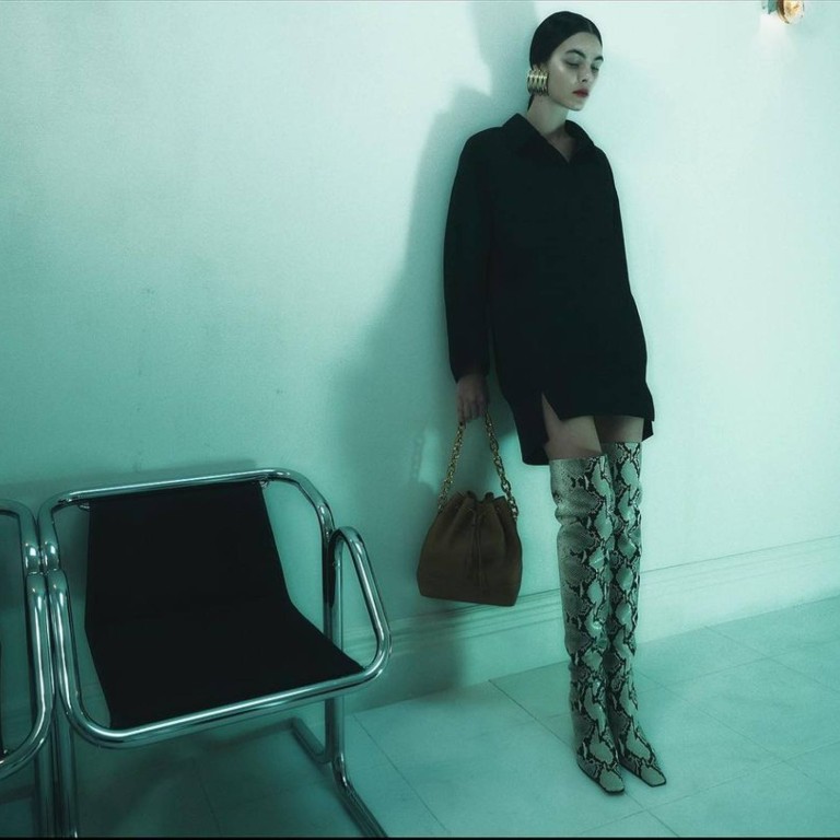 Gigi Hadid Wears TommyxGigi Sweater, Leggings and Ankle Boots in Dubai