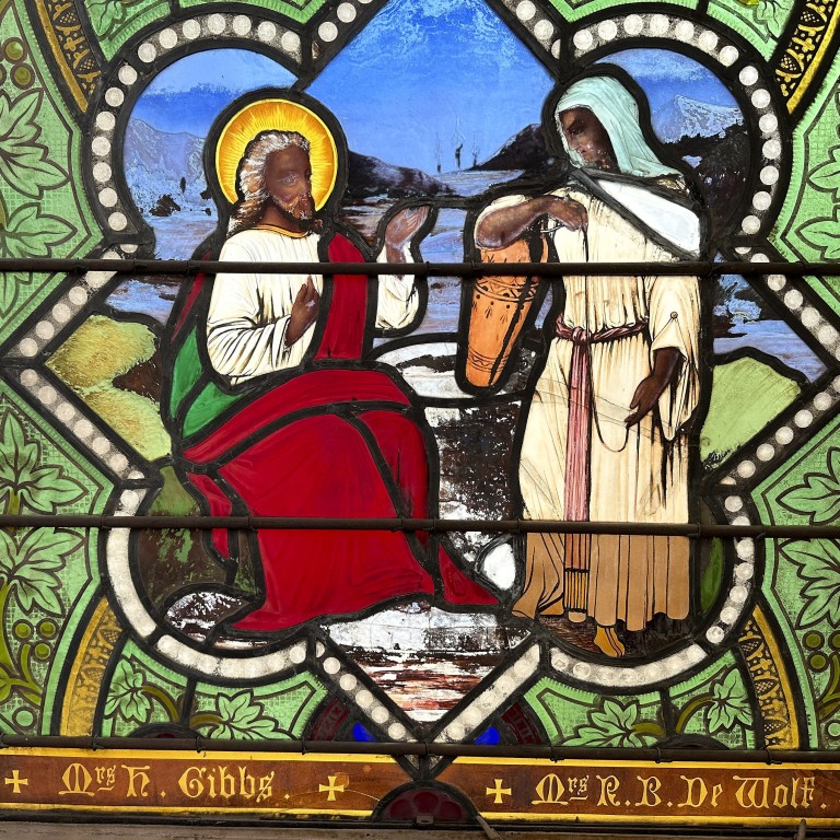 Stained glass window shows Jesus Christ with dark skin, stirring ...
