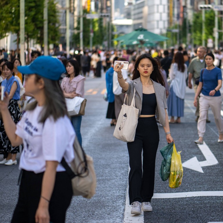 Pedestrians walk through the Ginza district of Tokyo on June 17. Buyers get more bang for their buck in Japan’s capital, compared with Hong Kong, Singapore, London and New York. Photo AFP