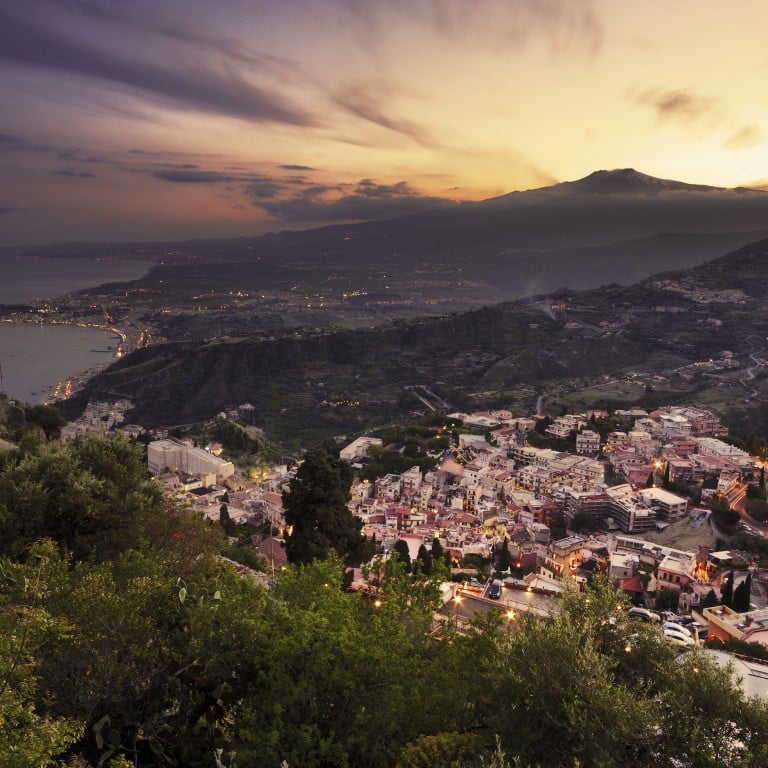 An aerial view of Mount Etna at sunset from Taormina in Sicily, Italy. Photo: Shutterstock