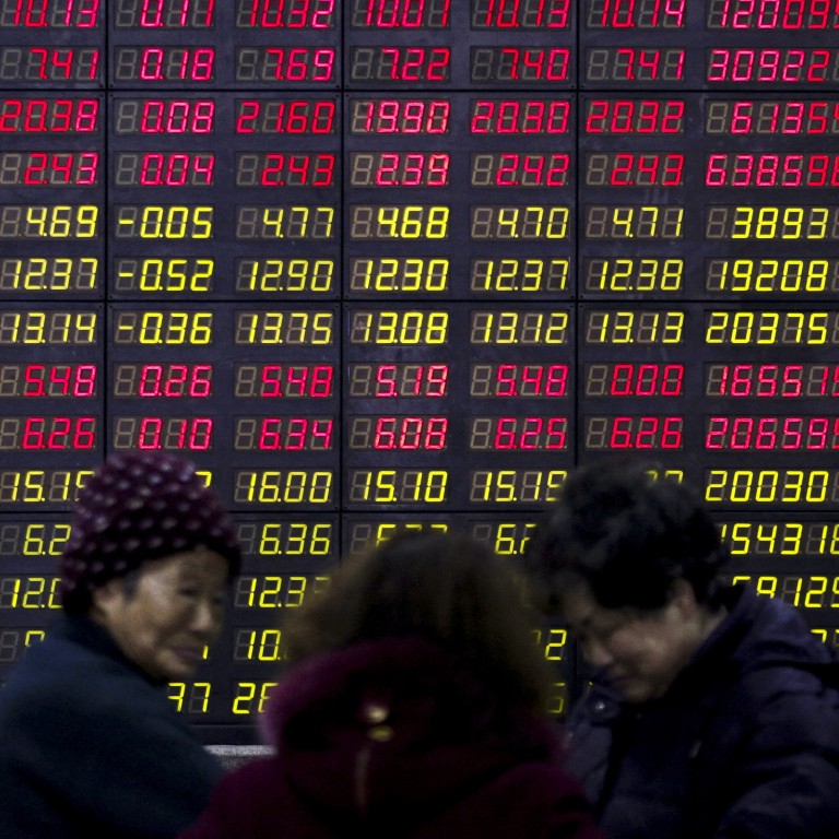 Investors stand in front of an electronic board showing stock information on the first trading day after the week-long Lunar New Year holiday at a brokerage house in Shanghai, China. Chinese companies raised a combined US$31.3 billion from IPO flotations on the Shanghai, Shenzhen and Beijing exchanges in the six months to June. Photo: Reuters