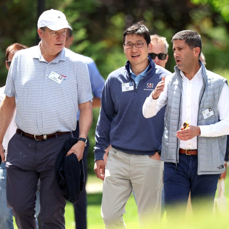 Bom Kim (centre), founder and CEO of Coupang, walks with investor Stan Druckenmiller and member of the Federal Reserve Board of Governors Kevin Warsh at the Allen & Company Sun Valley Conference on July 13, in Sun Valley, Idaho. Photo: AFP