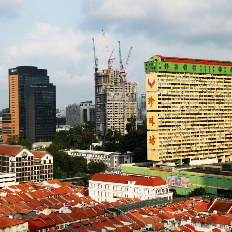 Singapore says foreigners need approval to buy mixed commercial and