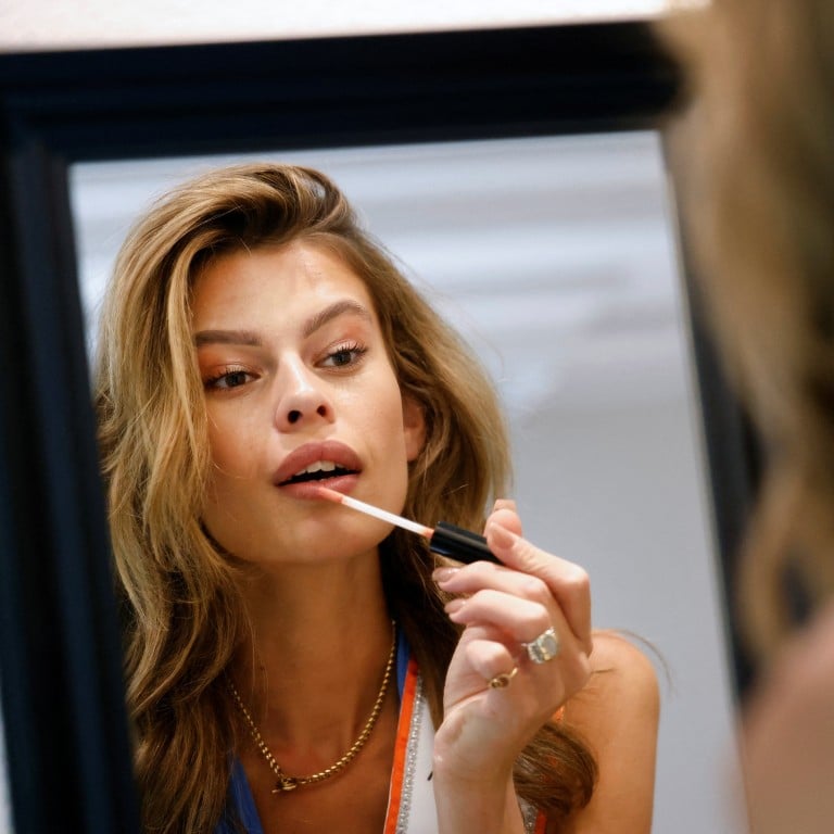 Rikkie Valerie Kolle, the first transgender woman to be crowned Miss Netherlands in 94 years, puts on her makeup in Voorthuizen, Netherlands, on July 12. Photo: Reuters