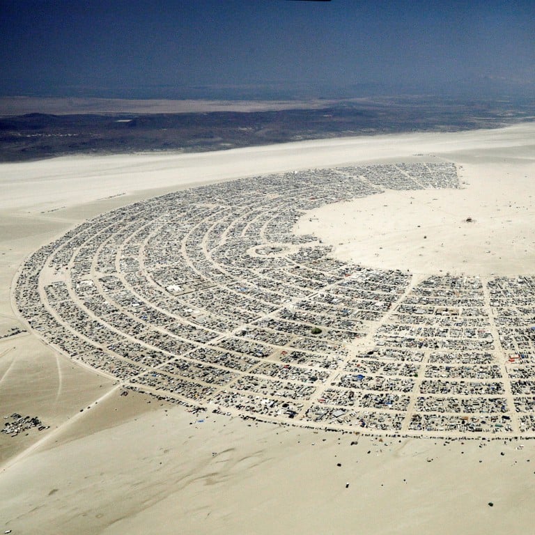 Thousands stuck at Burning Man festival as heavy rain turns desert into mud