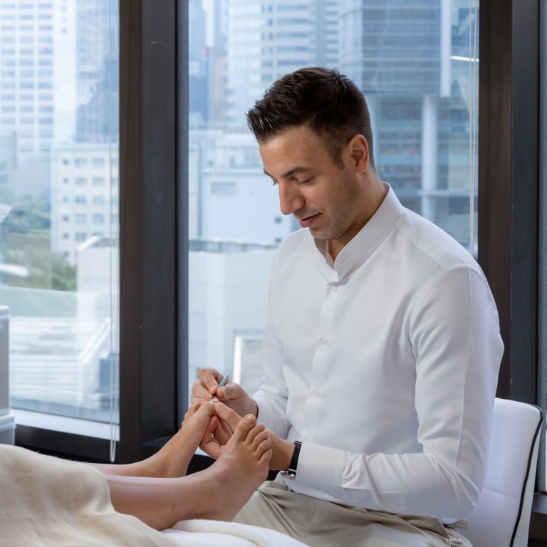 Footballer-turned-podiatrist Albin Brion treats clients at his newly opened Foot Atelier in Hong Kong. Photo: Handout