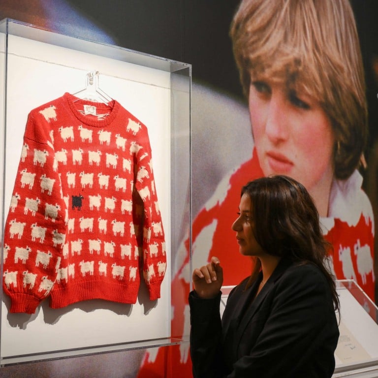 Princess Diana’s black sheep jumper on display at Sotheby’s auction house on July 17 ahead of its sale. Photo: AFP