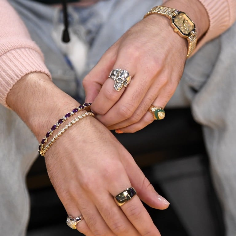 Bad Bunny toys with his jewellery at a Los Angeles Lakers and Memphis Grizzlies basketball game in January, while on his other wrist is his Patek Philippe’s women’s watch. Photo: Getty Images