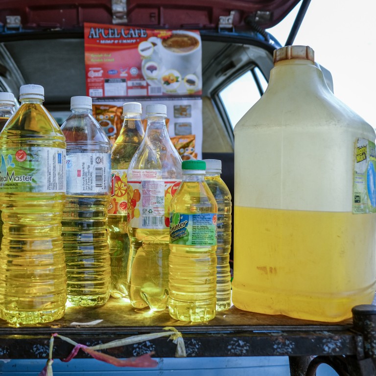 RON-95 petrol for sale at a roadside stall in a village in Klang, Selangor. Malaysia is aiming to implement a targeted subsidy scheme to help those in need. Photo: Bloomberg