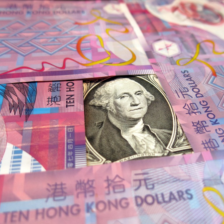 As Hong Kong’s currency peg turns 40, analysts are divided if it should