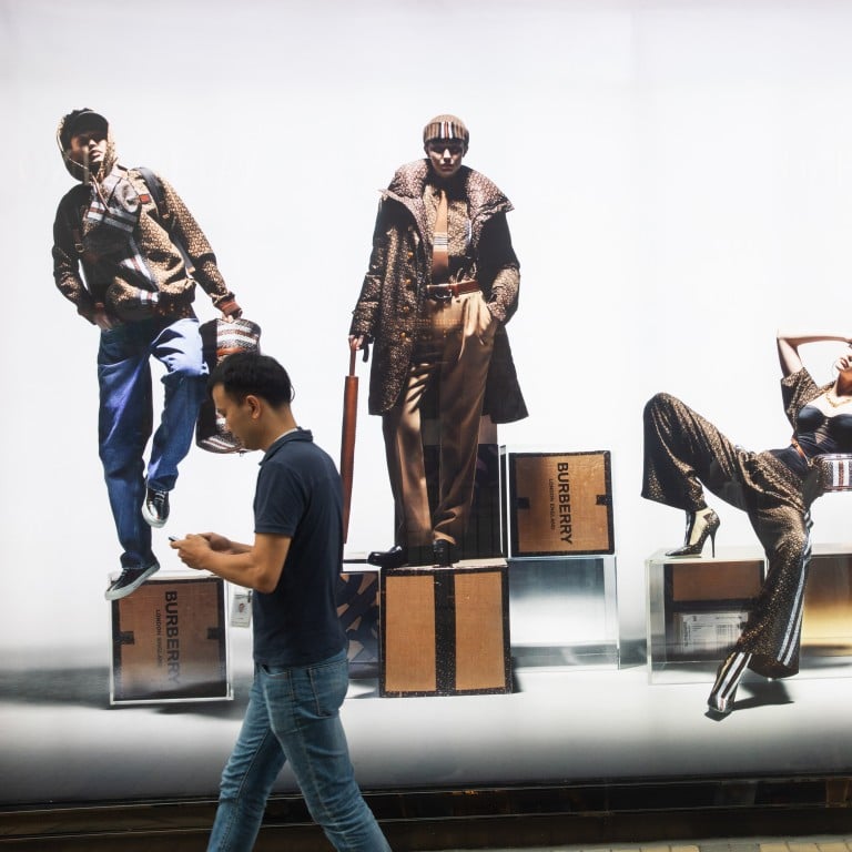 Pedestrians walk past a Burberry store on popular luxury shopping street Canton Road in Tsim Sha Tsui, Hong Kong, in July 2019. Photo: Bloomberg
