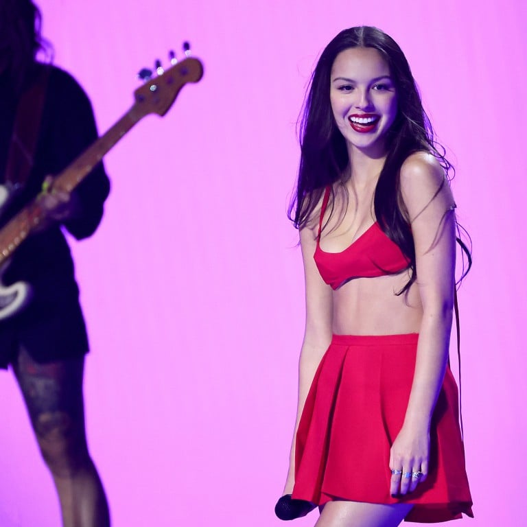 Olivia Rodrigo performs onstage the 2023 MTV Video Music Awards, rocking an on-trend plaid mini-skirt. Photo: Getty Images