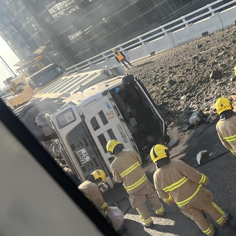Hong Kong driver escapes injury after dump truck topples over and ...