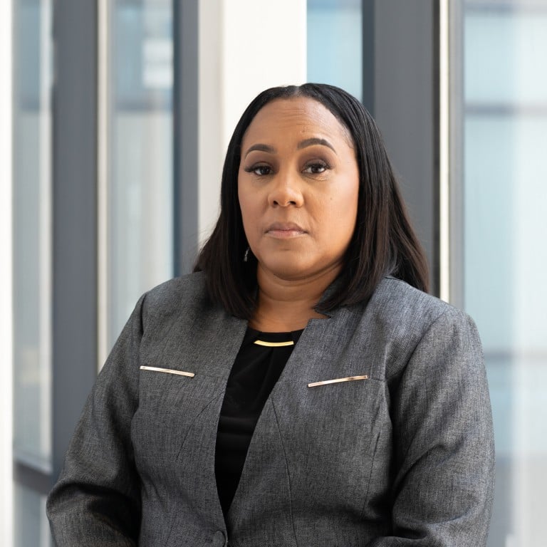 From launching a probe into Donald Trump’s conduct during the 2020 presidential election, to nearly being pulled from said Georgia election case for a romantic relationship with a special prosecutor she appointed, Fulton County’s first female DA is a woman who doesn’t fear The Donald and says she prefers Grey Goose vodka to wine. Photo: Getty Images