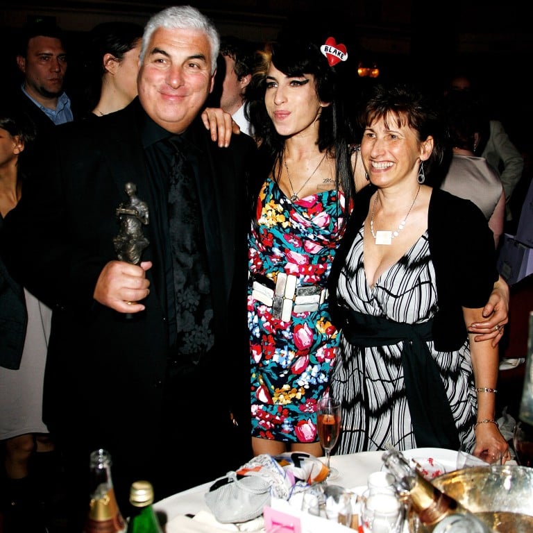 Amy Winehouse, her father Mitch and mother Janis pose with Amy’s award for Best Song Musically and Lyrically for ‘Love Is a Losing Game’ at the 53rd Ivor Novello Awards at the Grosvenor House Hotel, in 2008, in London, England. Photo: Getty Images