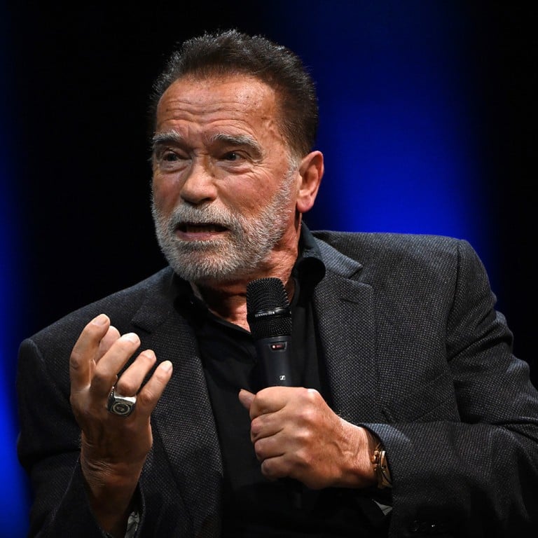 Arnold Schwarzenegger speaks onstage at London Palladium in October 2023, in London, exposing the hint of a quality timepiece on his wrist. Photo: Getty Images
