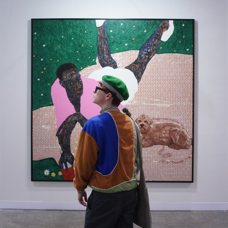 A visitor to Gallery 1957’s booth at this year’s Art Basel Hong Kong, at the Hong Kong Convention and Exhibition Centre in Wan Chai. Photo: Eugene Lee