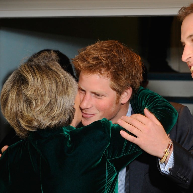 Prince Harry embracing Claire van Straubenzee as his brother Prince William looks on at the formal launch of the Henry van Straubenzee Memorial Fund in 2009. Photo: WPA/Getty Images