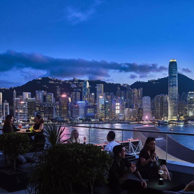 Diners enjoy drinks with views of the city skyline from the terrace at Aqua, one of many Hong Kong restaurants enticing diners with seasonal promotions this summer. Photo: Handout
